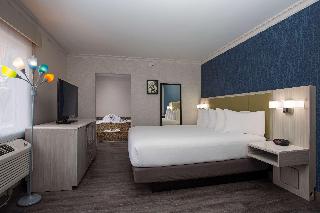 SUITE-1 KING BED,NSMK,COURT,JACZZ,MICRFG,FLATSC,CONTINENTAL BREAKFAST