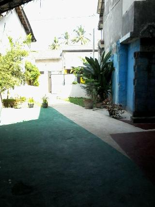 Malika's Yellow House