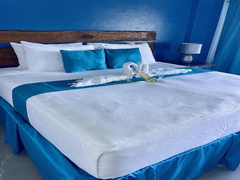 Sand And Tan Beach Hotel image