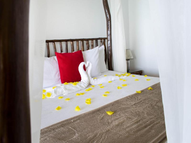 Sand And Tan Beach Hotel image