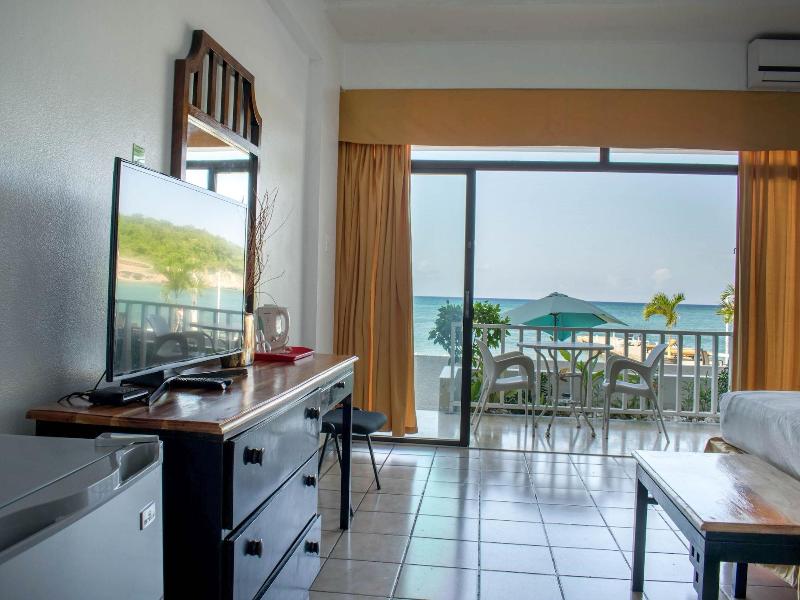 Sand And Tan Beach Hotel image