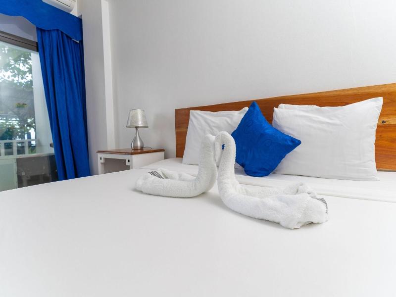 Sand And Tan Beach Hotel image