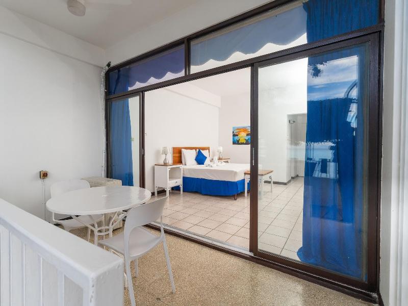 Sand And Tan Beach Hotel image