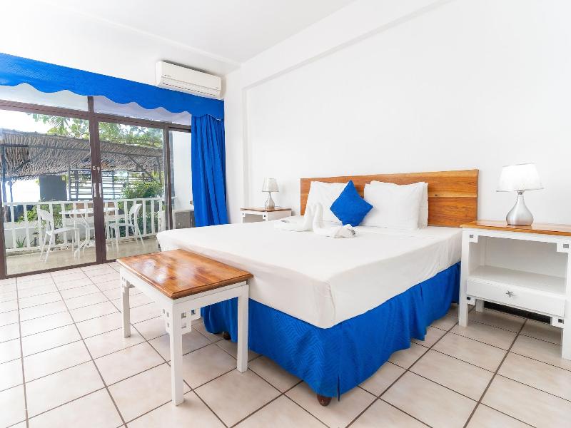Sand And Tan Beach Hotel image