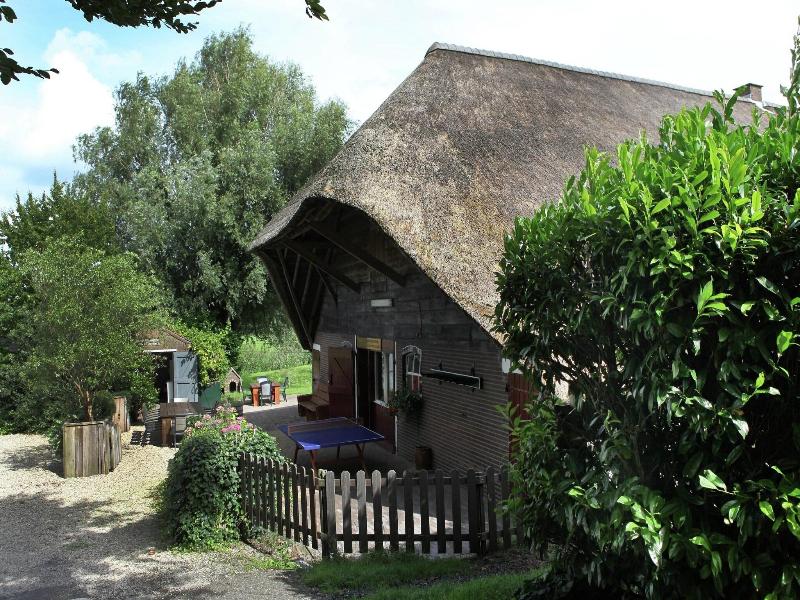 Quaint Farmhouse Near River In Oosterwijk image