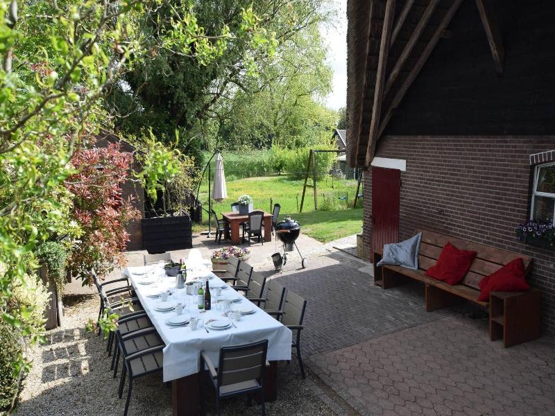 Quaint Farmhouse Near River In Oosterwijk image