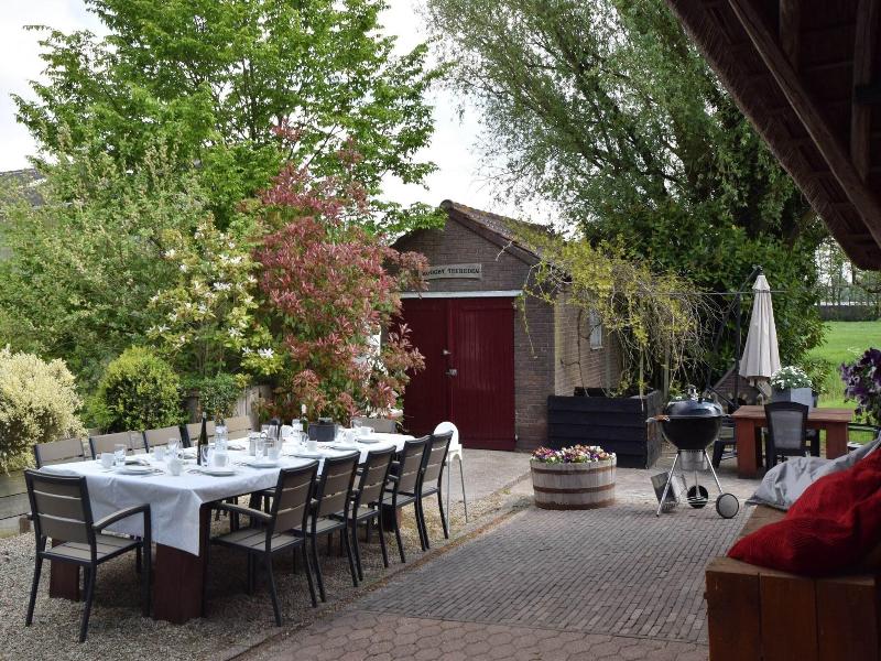 Quaint Farmhouse Near River In Oosterwijk image