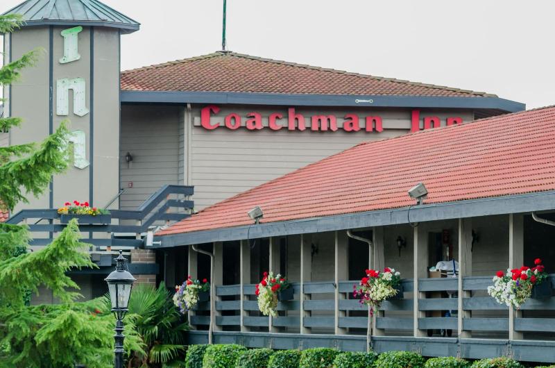 Coachman Inn & Suites image