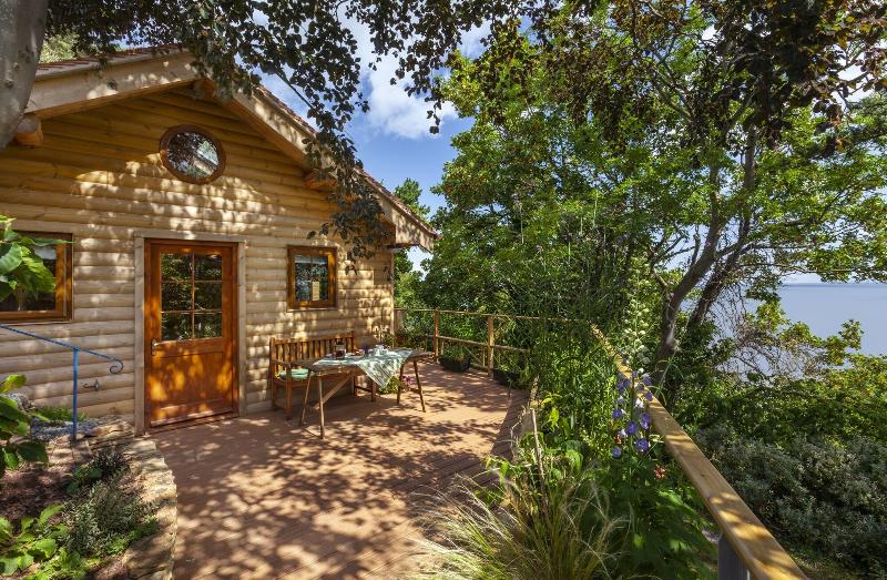 Porthole Log Cabin image