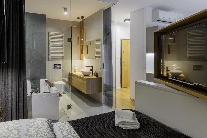 Glass House Hot Tub Apartments image