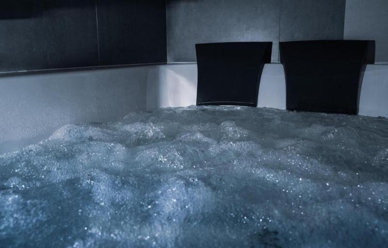 Glass House Hot Tub Apartments image