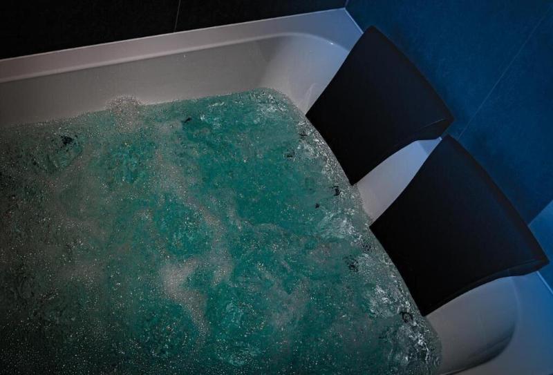 Glass House Hot Tub Apartments image