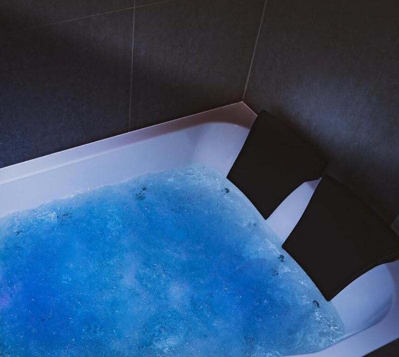 Glass House Hot Tub Apartments image