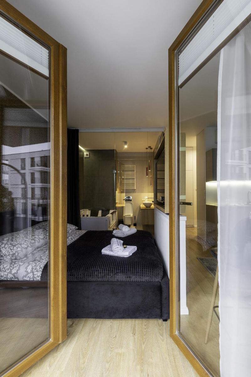 Glass House Hot Tub Apartments image