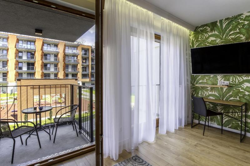 Glass House Hot Tub Apartments image
