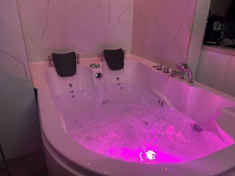 Glass House Hot Tub Apartments image