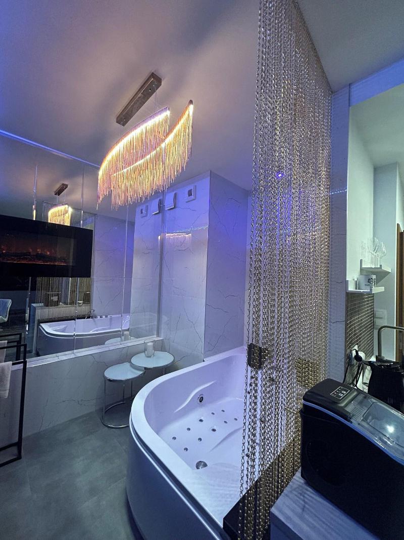 Glass House Hot Tub Apartments image