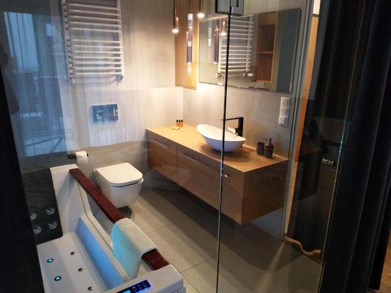 Glass House Hot Tub Apartments image