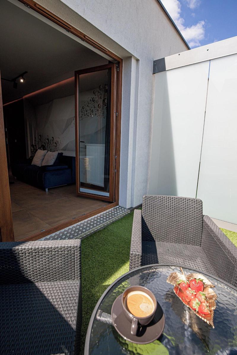 Glass House Hot Tub Apartments image