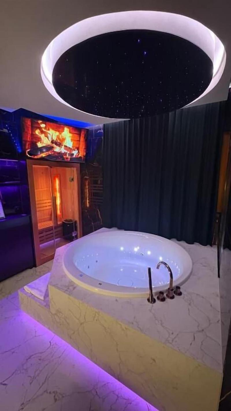Glass House Hot Tub Apartments image
