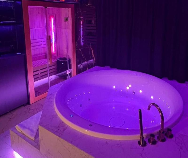 Glass House Hot Tub Apartments image