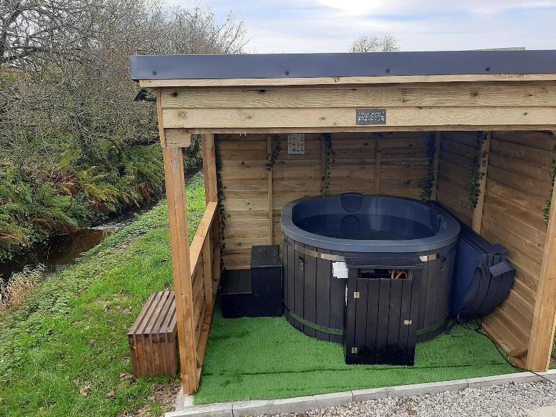 Luxury Shepherds Hut With Spa Hot Tub On Anglesey image