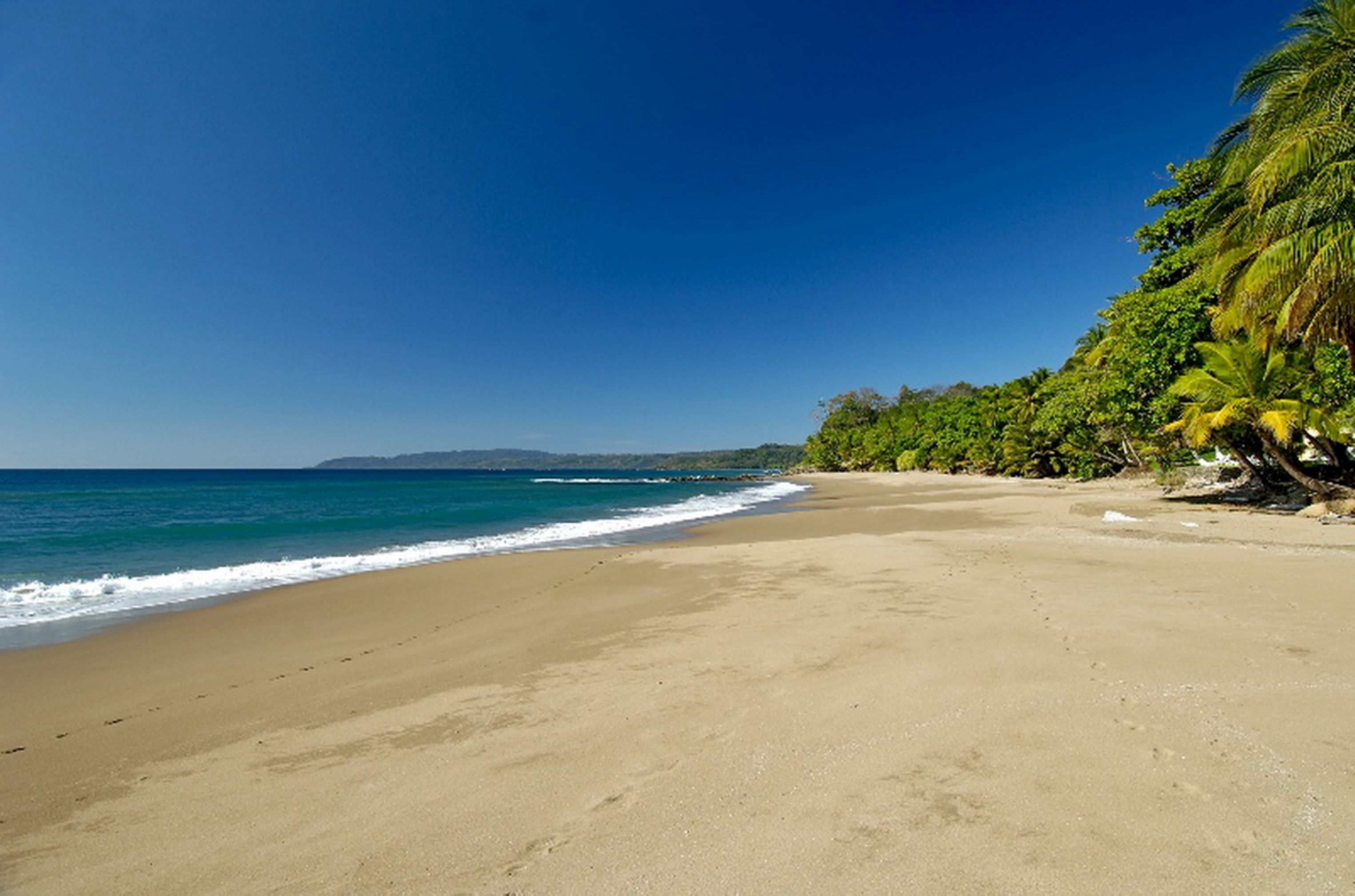Φωτογραφία του Tango Mar Beach με φωτεινή άμμος επιφάνεια