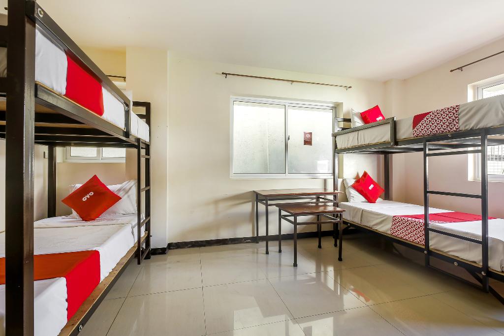 Vaccinated Staff - OYO 842 City Smiles Apartelle